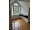 Bright room with hardwood floors, dormer windows, and a floating shelf provides a stylish workspace at 6283 Harrisontown Rd, Rocky Mount, NC 27804
