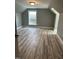 Cozy room with stylish gray walls and vinyl plank floors at 6283 Harrisontown Rd, Rocky Mount, NC 27804