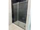 Modern bathroom shower with black tile and glass doors at 6283 Harrisontown Rd, Rocky Mount, NC 27804