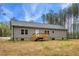 New construction featuring back of home and backyard with wood deck and green surroundings at 6312 Briddle Dr, Wendell, NC 27591