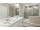Modern bathroom featuring a dual sink vanity and a tiled walk-in shower at 6312 Briddle Dr, Wendell, NC 27591