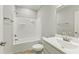 Bright bathroom featuring a tub-shower combo and a white single sink vanity at 6312 Briddle Dr, Wendell, NC 27591