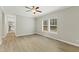 Bright bedroom featuring luxury vinyl plank flooring and a window with natural light at 6312 Briddle Dr, Wendell, NC 27591