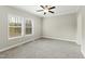 Comfortable carpeted bedroom featuring recessed lighting, a ceiling fan, and bright windows at 6312 Briddle Dr, Wendell, NC 27591
