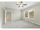 Bright bedroom featuring carpet, recessed lighting, ceiling fan, and multiple windows at 6312 Briddle Dr, Wendell, NC 27591