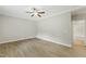 Spacious bedroom with modern ceiling fan and luxury vinyl plank flooring at 6312 Briddle Dr, Wendell, NC 27591