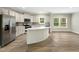 Kitchen with stainless steel appliances, a marble-topped island, and stylish white cabinetry at 6312 Briddle Dr, Wendell, NC 27591