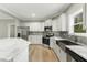 Modern kitchen featuring stainless steel appliances, white cabinetry, and an undermount stainless sink at 6312 Briddle Dr, Wendell, NC 27591