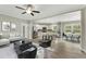 Spacious living area with an open floor plan, modern furniture, and seamless flow to the kitchen and dining space at 6312 Briddle Dr, Wendell, NC 27591