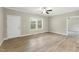 Spacious living room showcasing wood-look floors, base molding, and natural light from the windows at 6312 Briddle Dr, Wendell, NC 27591