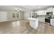 Open floor plan showcasing a living room and kitchen with abundant natural light and modern finishes at 6312 Briddle Dr, Wendell, NC 27591