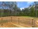 New construction home featuring back wood deck with forest views and greenery at 6312 Briddle Dr, Wendell, NC 27591