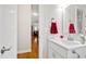 Bright bathroom with a white vanity, decorative mirror, and stylish fixtures, offering a welcoming space at 6819 Franklin Heights Rd, Cary, NC 27518