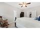 This bedroom features neutral walls, a ceiling fan, a rocking chair, and comfortable furniture at 6819 Franklin Heights Rd, Cary, NC 27518