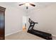 A versatile room with neutral walls is currently setup as an exercise room with a treadmill at 6819 Franklin Heights Rd, Cary, NC 27518