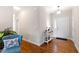 Bright foyer featuring hardwood floors, a console table, and a view of the front door at 6819 Franklin Heights Rd, Cary, NC 27518