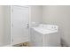 The Laundry room features a white washer and dryer, along with a door to the outside at 6819 Franklin Heights Rd, Cary, NC 27518