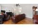 Comfortable living room with hardwood floors, a fireplace, and a view into the adjoining room at 6819 Franklin Heights Rd, Cary, NC 27518