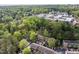 An aerial view of the community and lush surrounding woods as it blends into the urban landscape at 708 Martin Luther King Jr. Blvd # E2, Chapel Hill, NC 27514