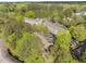 Aerial view of the multi-Gathering property nestled between mature trees and lush green surroundings at 708 Martin Luther King Jr. Blvd # E2, Chapel Hill, NC 27514