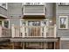An exterior view of a balcony with white railings on a multi-story home at 708 Martin Luther King Jr. Blvd # E2, Chapel Hill, NC 27514