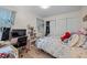 Bright bedroom featuring a functional workspace, closet, and comfortable bed at 708 Martin Luther King Jr. Blvd # E2, Chapel Hill, NC 27514