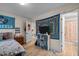 Comfortable bedroom featuring stylish decor, light wood floors, and an en suite bathroom at 708 Martin Luther King Jr. Blvd # E2, Chapel Hill, NC 27514