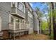Exterior view showcasing the building design with private decks and lush surrounding greenery at 708 Martin Luther King Jr. Blvd # E2, Chapel Hill, NC 27514