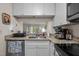 Modern kitchen with granite countertops, white cabinets, stainless steel appliances and opening to living space at 708 Martin Luther King Jr. Blvd # E2, Chapel Hill, NC 27514
