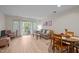 Bright living area featuring hardwood floors, neutral paint and sliding glass doors to a balcony at 708 Martin Luther King Jr. Blvd # E2, Chapel Hill, NC 27514