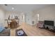 Open living area featuring hardwood floors and an opening to the updated kitchen at 708 Martin Luther King Jr. Blvd # E2, Chapel Hill, NC 27514