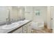 Bathroom featuring double sinks, granite counters, bathtub and walk-in shower at 7120 Guess Rd, Hillsborough, NC 27278
