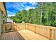 Wooden deck with wooded backdrop, perfect for outdoor entertaining at 7120 Guess Rd, Hillsborough, NC 27278
