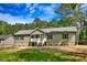Inviting single-Gathering home with a charming front porch, neat landscaping, and a well-maintained yard at 7120 Guess Rd, Hillsborough, NC 27278