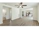 Bright living room showcasing an open floor plan connecting to a stylish, modern kitchen at 7120 Guess Rd, Hillsborough, NC 27278