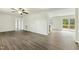 Open concept living room featuring vinyl floors, white walls, and lots of natural light at 7120 Guess Rd, Hillsborough, NC 27278