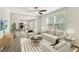 Open-concept living area featuring modern decor, wood floors, and seamless integration with the kitchen at 7120 Guess Rd, Hillsborough, NC 27278
