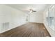 Bright living room with vinyl floors, ceiling fan, and double windows at 7120 Guess Rd, Hillsborough, NC 27278