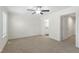 Bright carpeted bedroom features access to a bathroom and a walk-in closet at 7122 Guess Rd, Hillsborough, NC 27278