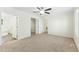 The carpeted bedroom boasts a ceiling fan, closet, and access to a bathroom at 7122 Guess Rd, Hillsborough, NC 27278