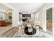 Light-filled dining room adjacent to the kitchen, featuring a stylish table and access to the backyard at 7122 Guess Rd, Hillsborough, NC 27278