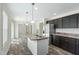 Modern kitchen with stainless steel appliances and a center island at 7122 Guess Rd, Hillsborough, NC 27278