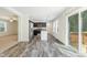 Open kitchen with stainless steel appliances and sliding glass doors to the deck at 7122 Guess Rd, Hillsborough, NC 27278