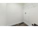 An unfinished laundry room with a wire shelf and connections for a washer and dryer at 7122 Guess Rd, Hillsborough, NC 27278