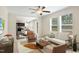 Open concept living area flows into the kitchen and dining, with modern furnishings and plenty of natural light at 7122 Guess Rd, Hillsborough, NC 27278