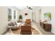Inviting living room featuring modern furnishings, neutral tones, and large windows for abundant natural light at 7122 Guess Rd, Hillsborough, NC 27278