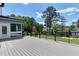 Back deck offering backyard views and black metal cable railing and canopy at 721 Shelley Rd, Raleigh, NC 27609