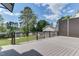 Back deck offering backyard views, black railing and an enclosed decorative dark wood fence at 721 Shelley Rd, Raleigh, NC 27609