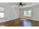 Spacious bedroom with hardwood floors, crown molding, and ample natural light at 721 Shelley Rd, Raleigh, NC 27609