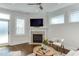 Bright living room features a modern fireplace, neutral tones, and ample natural light at 721 Shelley Rd, Raleigh, NC 27609